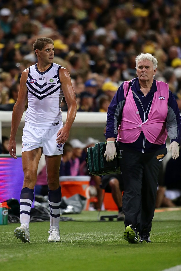 AFL 2016 Rd 03 - West Coast v Fremantle PERTH, AUSTRALIA - APRIL 9: Aaron Sandilands of the Dockers leavers the field injured during the 2016 AFL Round 03 match between the West Coast Eagles and the Fremantle Dockers at Domain Stadium, Perth on April 9, 2016. (Photo by Will Russell/AFL Media)